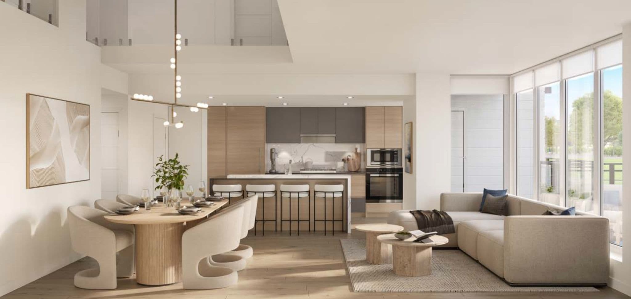 Park Residences II – Open-concept kitchen and living space with wood and grey cabinetry, a marble-topped island with bar stools, a curved wood dining table, and a beige sectional sofa under a double-height ceiling.