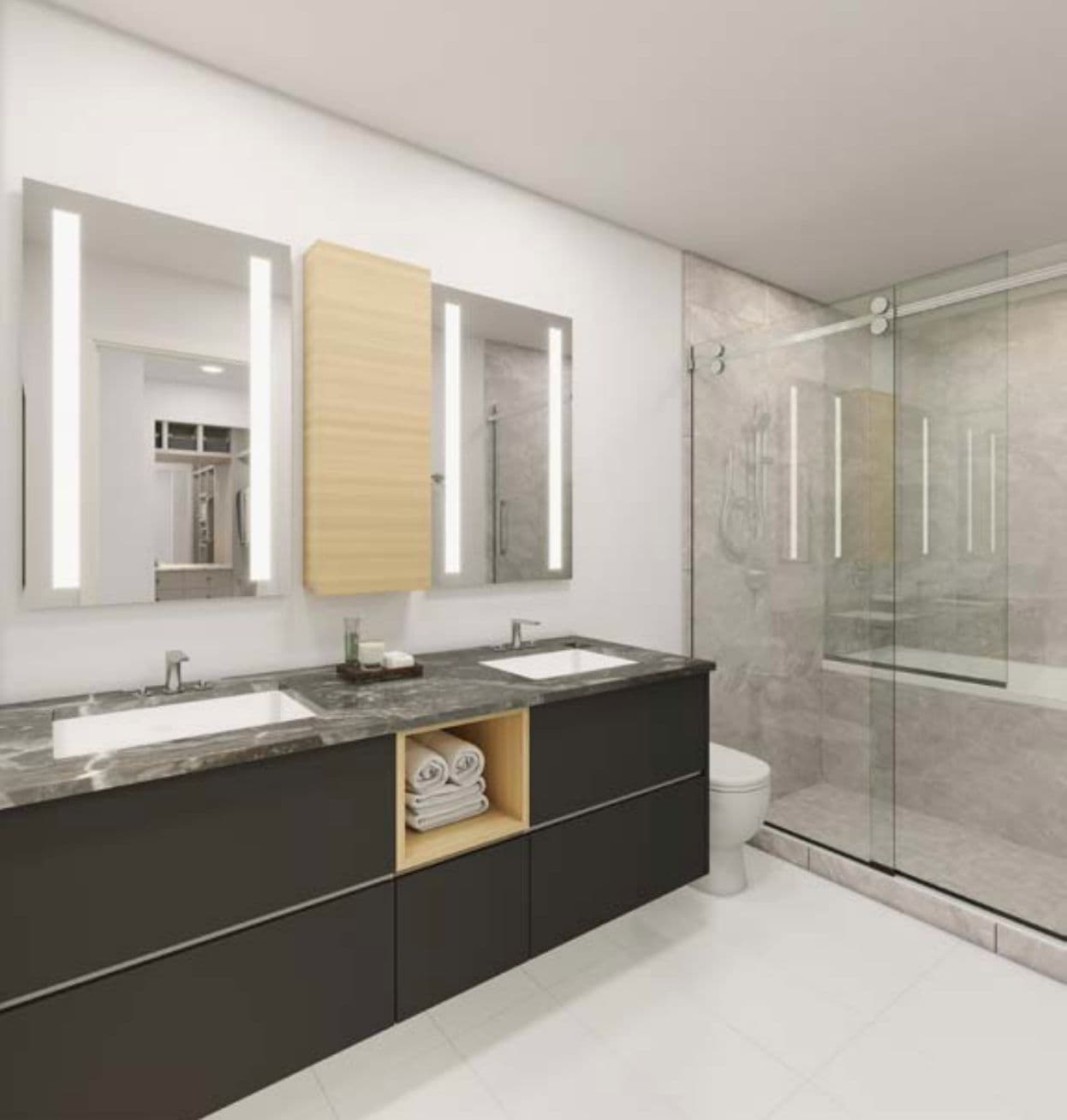 Park Residences II – Bathroom with a dark double vanity, backlit mirrors, a wood accent cabinet with folded towels, a toilet, and a glass-enclosed shower with marble-look tile.