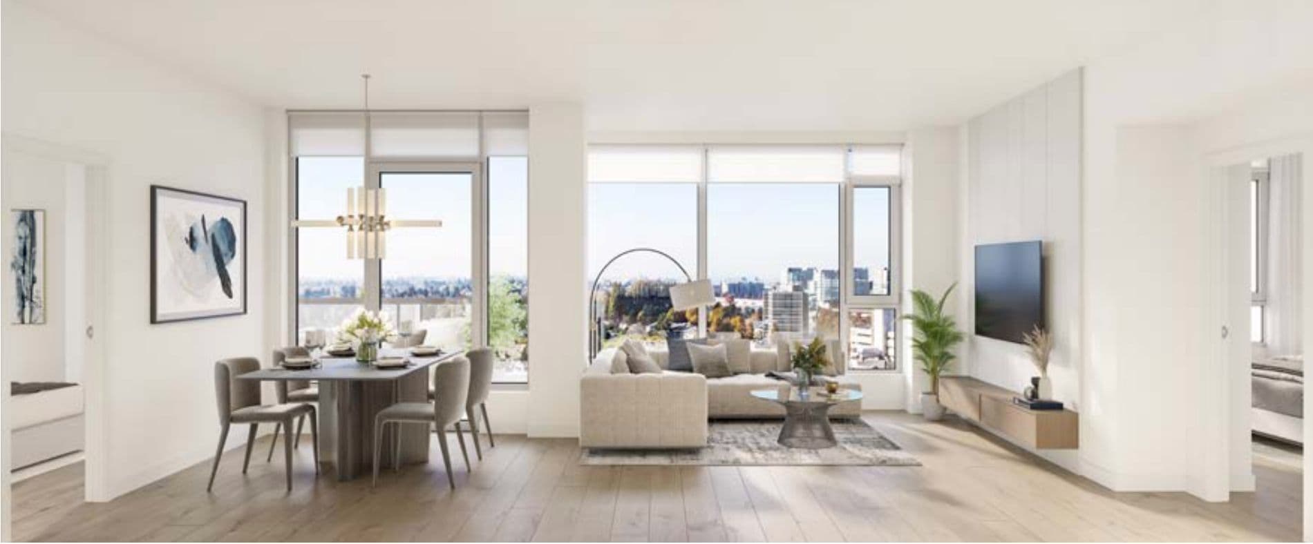 Park Residences II – Living and dining room with a wood dining table and grey chairs, a beige sectional sofa, wall-mounted TV, and floor-to-ceiling windows showing a city view.