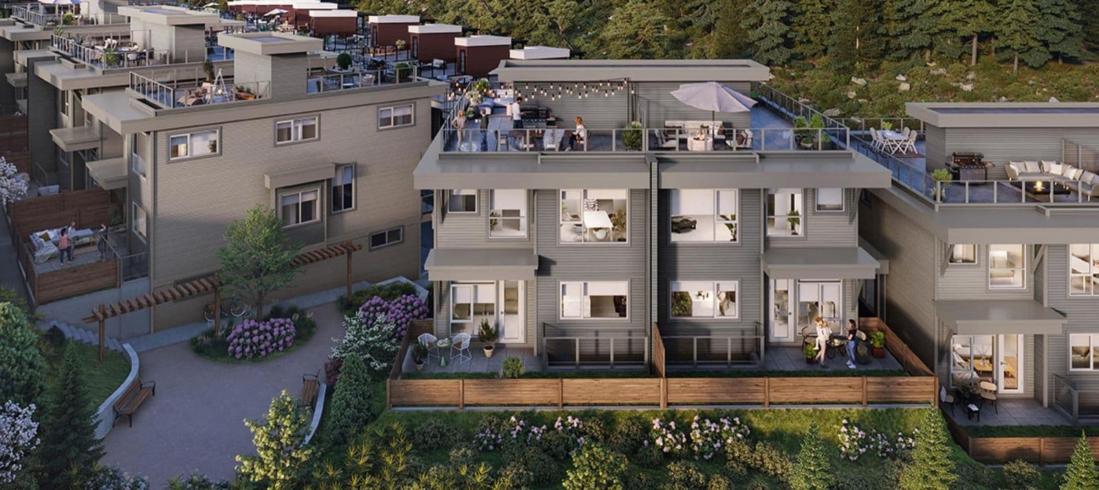 The Peak at Mountain View – Elevated view of townhome rooftop patios and courtyard walkway with pergolas, planters, and residents socializing outdoors.
