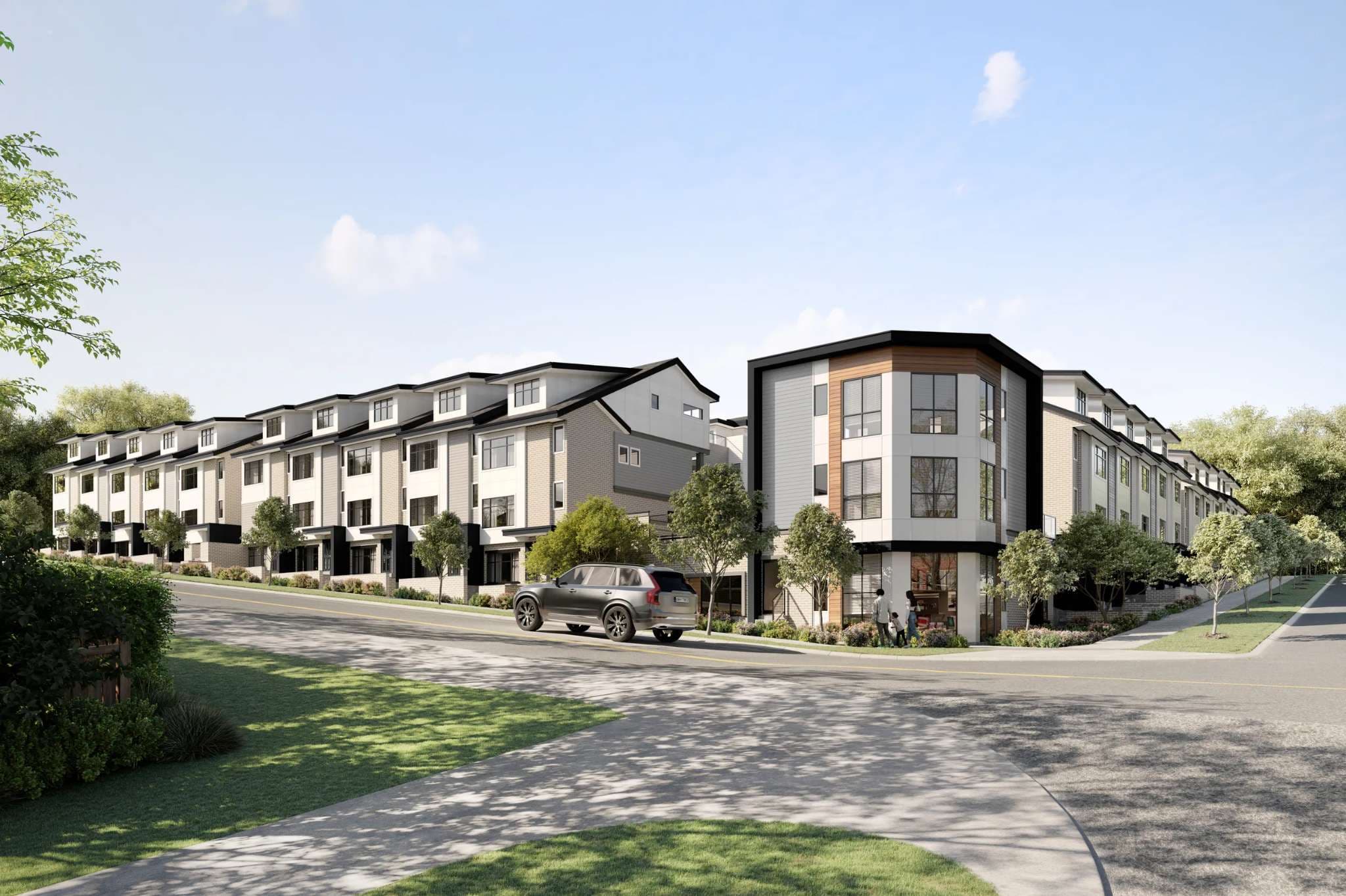 Goldstone – A daytime street-level architectural rendering of a modern multi-family townhouse community built along a gentle hill, featuring light-toned panel siding, dark trim, and pitched roofs. A corner unit with wood-accent paneling and ground-level storefront windows faces a quiet paved roadway with a landscaped sidewalk and a parked SUV.