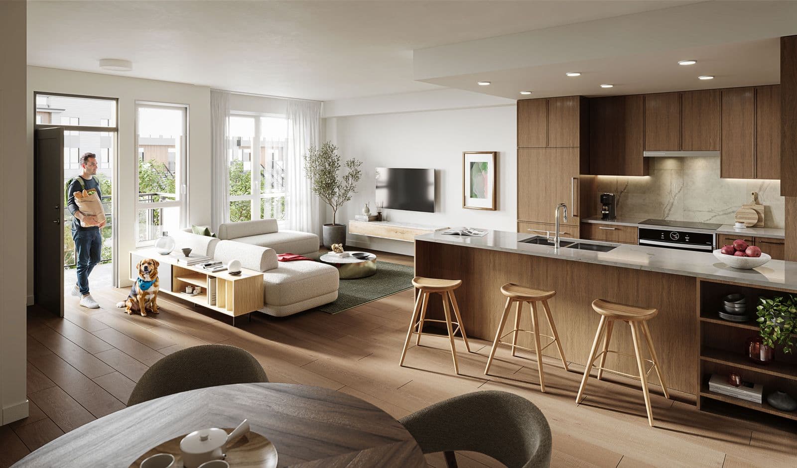 Kestrel – Open kitchen and living area with wood cabinetry, marble-look countertop island, wood bar stools, and a man entering from a balcony with groceries.