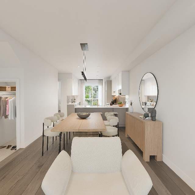 Samer – Rendering of a dining area with a wood table, white upholstered chairs, a round mirror, a wood sideboard, and a glimpse of the kitchen and a walk-in closet beyond.