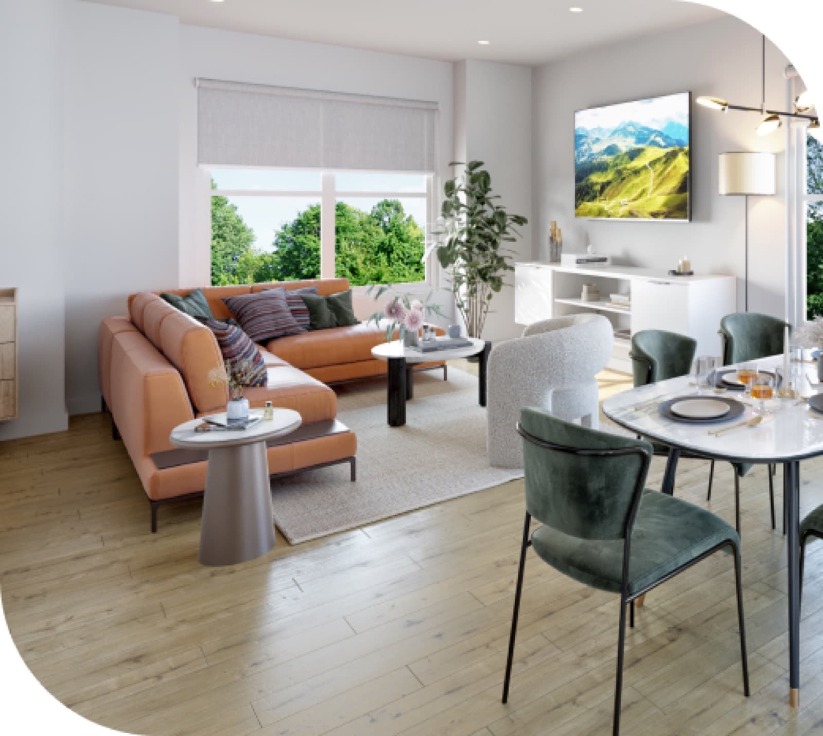 Havenwood in Sullivan – Open-concept living and dining area with an orange leather sectional, round dining table with green upholstered chairs, and a large window with tree views.