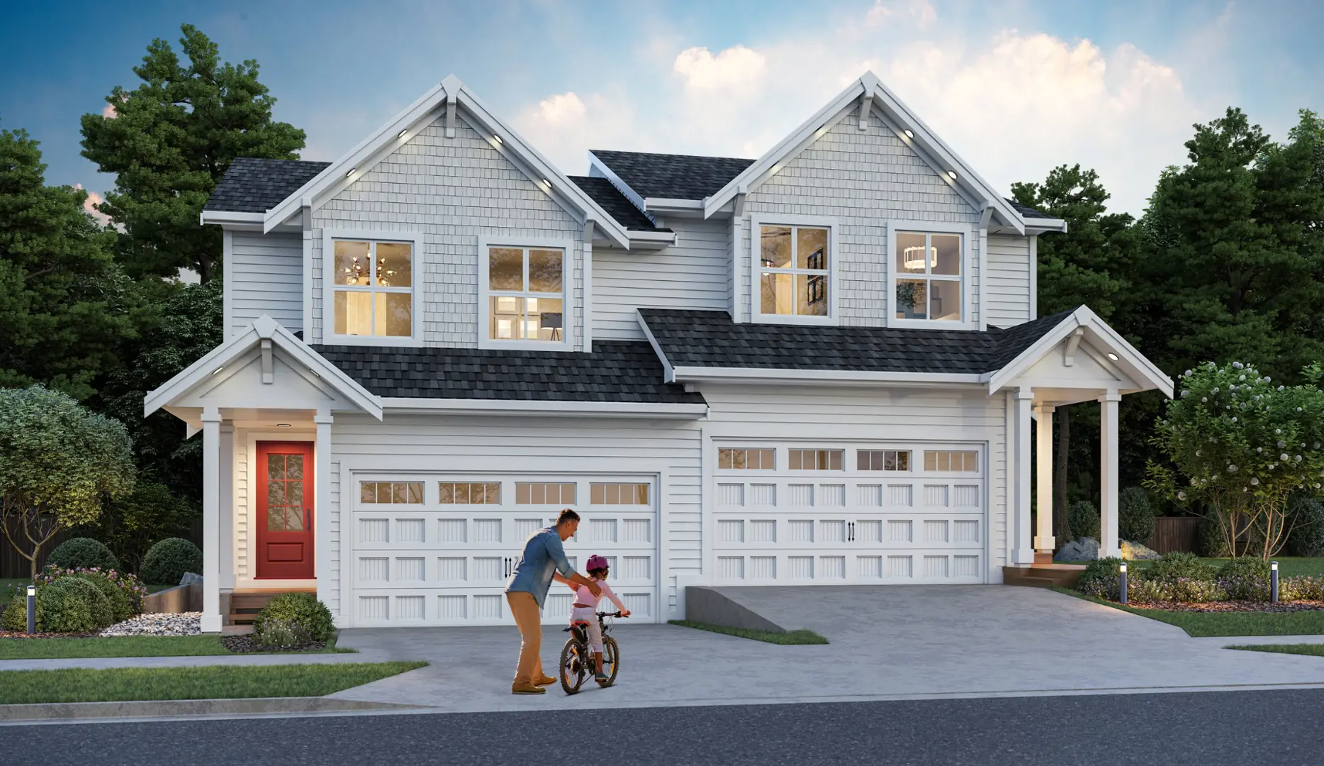 Blacktail – A two-story suburban duplex rendered with white siding, shingle accents, dark gabled roofs, and attached two-car garage bays, surrounded by landscaped shrubs and mature trees. In the concrete driveway, a father helps a young child learn to ride a bicycle in the warm light of early evening.