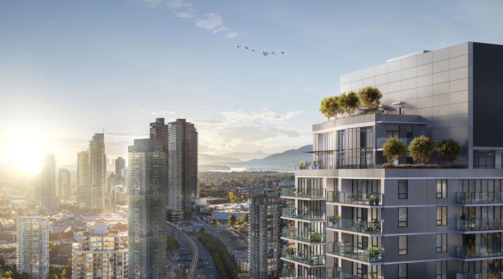 Slate – Close-up exterior of the tower's upper floors and rooftop greenery at sunrise, with the downtown skyline and mountains visible in the distance and birds flying past.