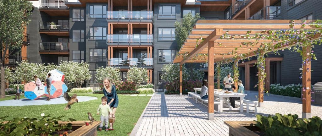 The Oaks Phase 3 (Willow) – A courtyard play area with a colorful climbing structure and a covered picnic pergola with families gathered at a table.