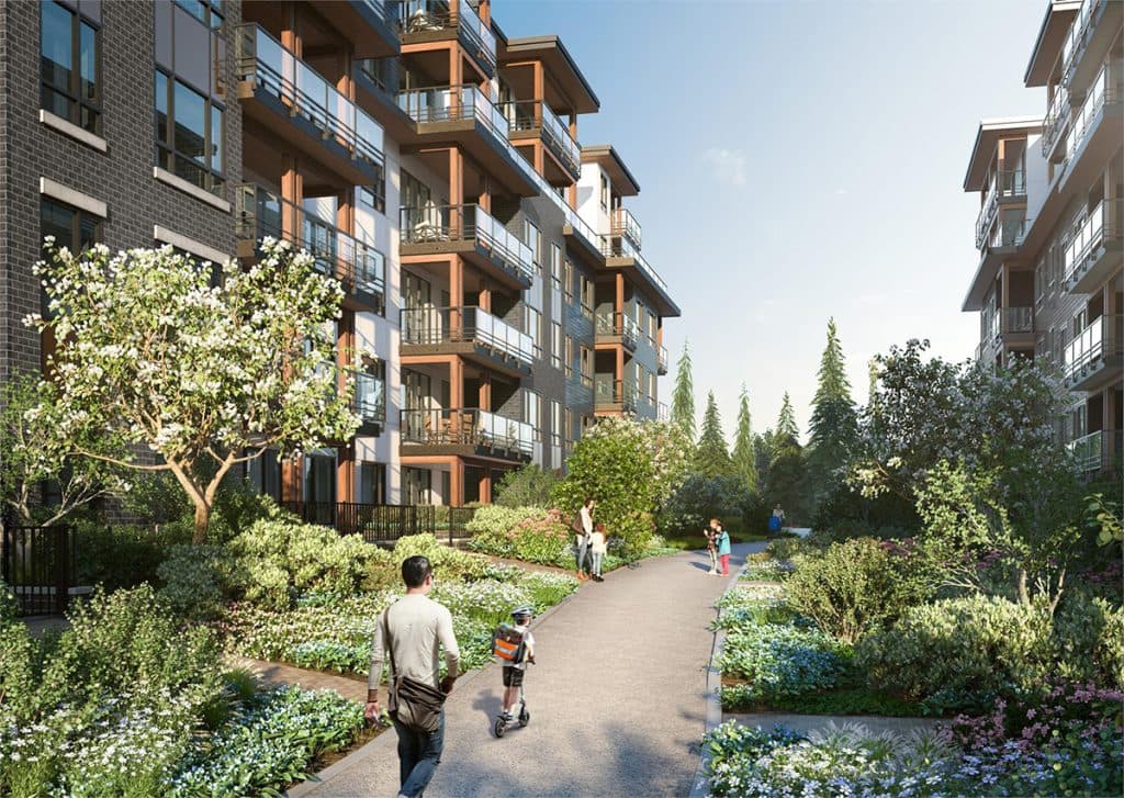 The Oaks Phase 3 (Willow) – A landscaped courtyard walkway between two mid-rise wood-and-brick apartment buildings, with a family walking and a child on a scooter.