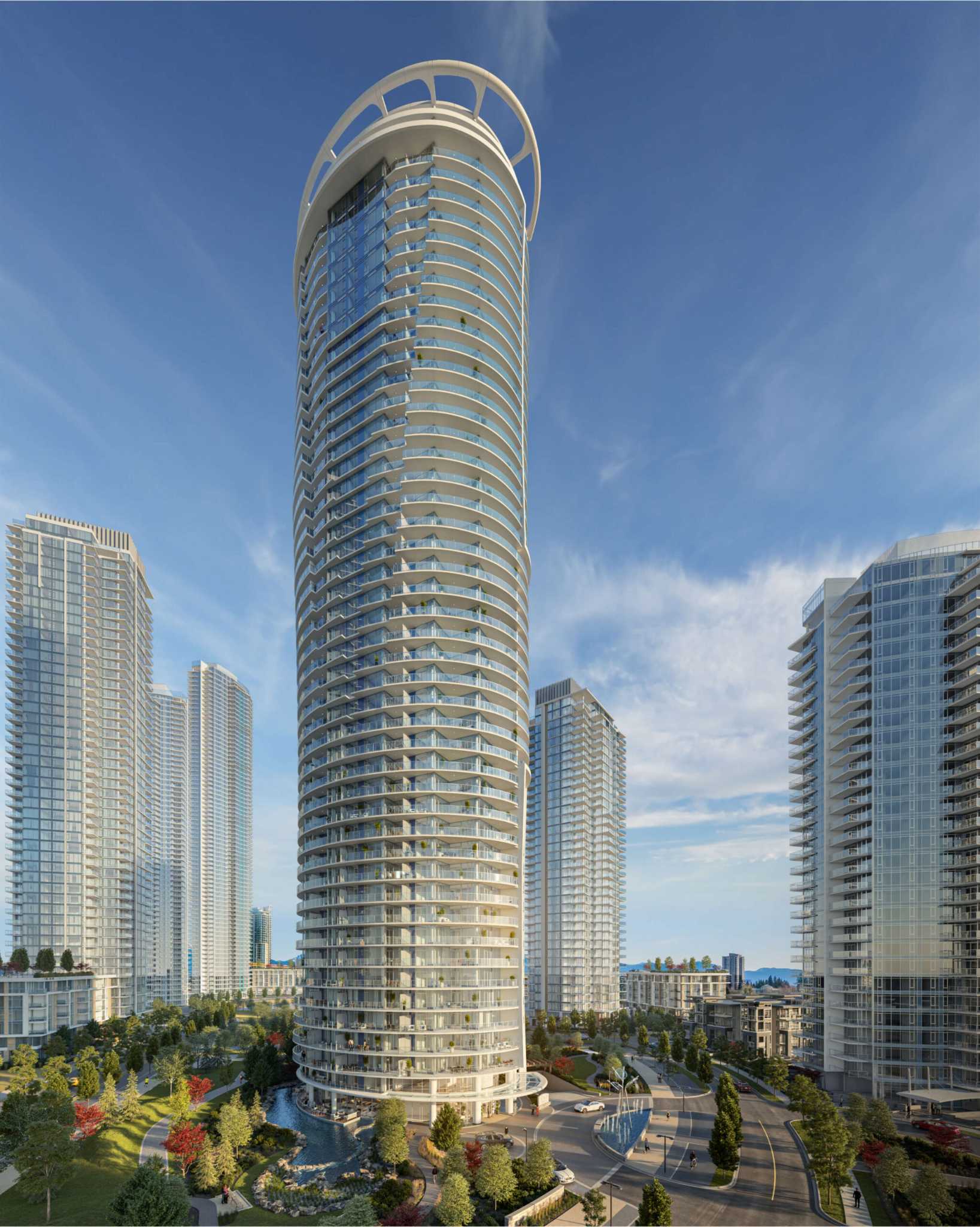 Icon at Southgate City – An elevated rendering of a soaring, cylindrical glass high-rise featuring curved wraparound balconies and a distinctive circular crown, set within a master-planned community of modern towers. Landscaped grounds below include paved roadways, water features, walking paths, and manicured greenery under a clear blue daytime sky.