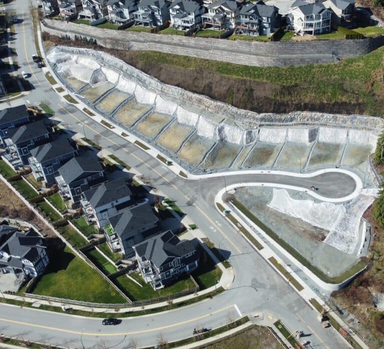 Brighton North – Overhead aerial drone photograph displaying the development site under construction, surrounding roads, and neighboring residential homes.
