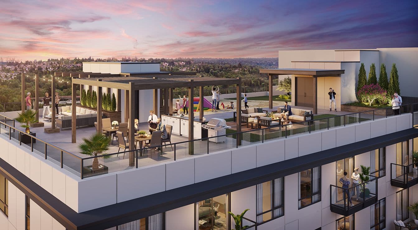 Linc Condos – A bustling rooftop amenity terrace features wooden pergolas, outdoor dining tables, a BBQ kitchen area, and lounge seating enclosed by glass railings. Set at sunset, residents gather against a panoramic backdrop of a lush green horizon under a vibrant pink and orange sky.