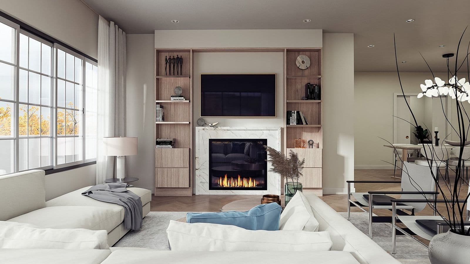 The Madison at Hunter Road – Living room with a gas fireplace, built-in wood shelving, and a TV mounted above the mantel.