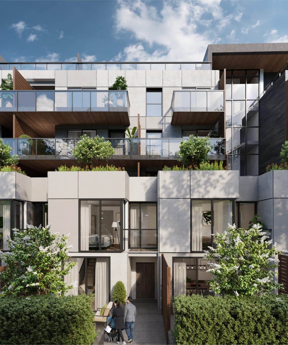 Pure West 49 – Street-level view of townhome-style units with private balconies, planted terraces, and landscaped ground-floor entries.