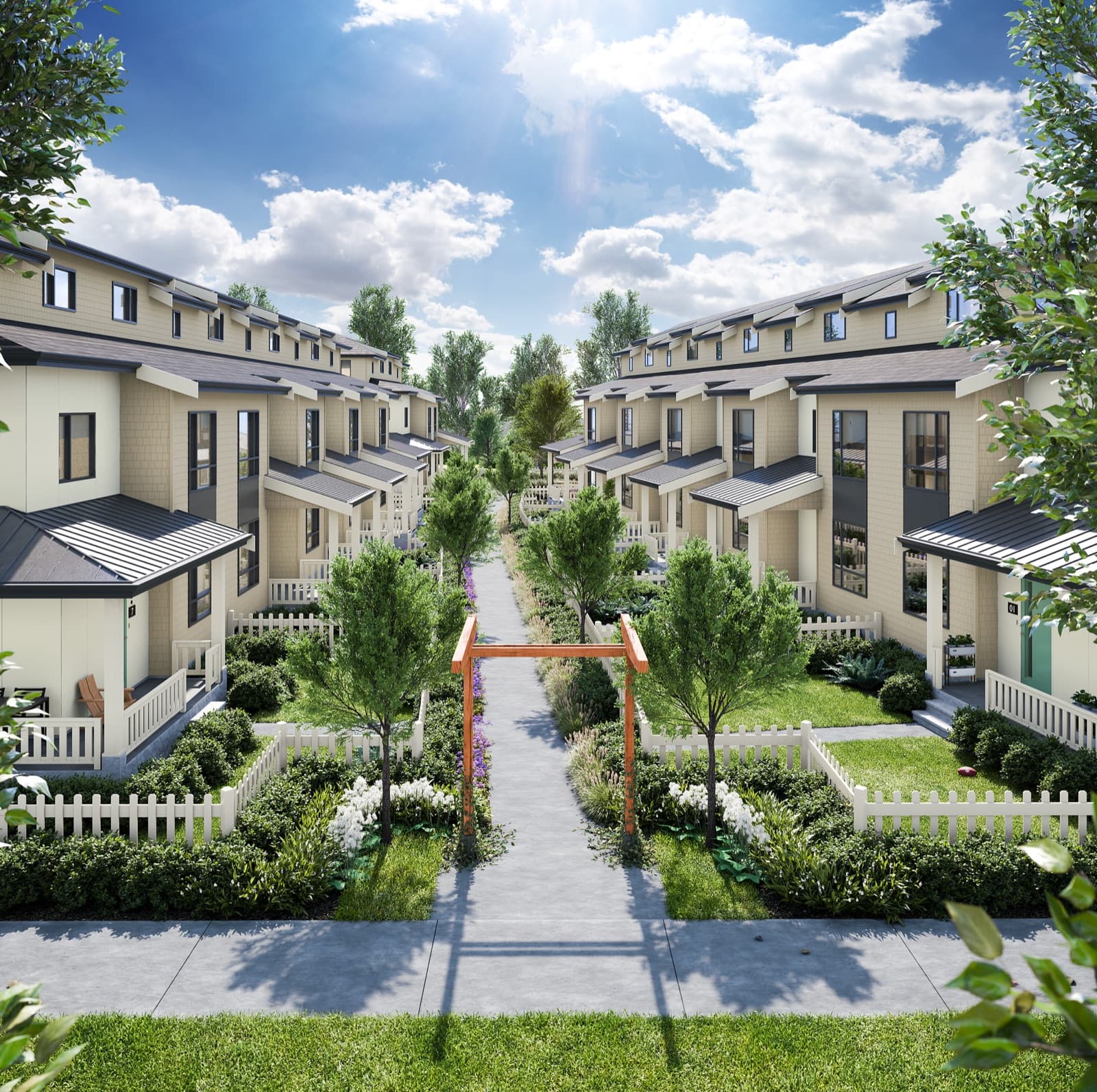 Southlands Tsawwassen – Two facing rows of beige craftsman-style townhomes with covered porches, white picket fences, and a landscaped central walkway with a wooden arbor.