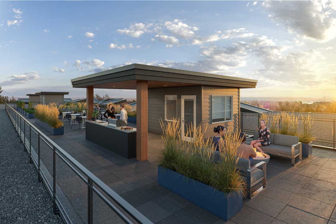 Inspire – Rooftop terrace at sunset with a covered lounge area, outdoor kitchen/BBQ counter, seating, a fire pit, and planters, overlooking the surrounding neighborhood.