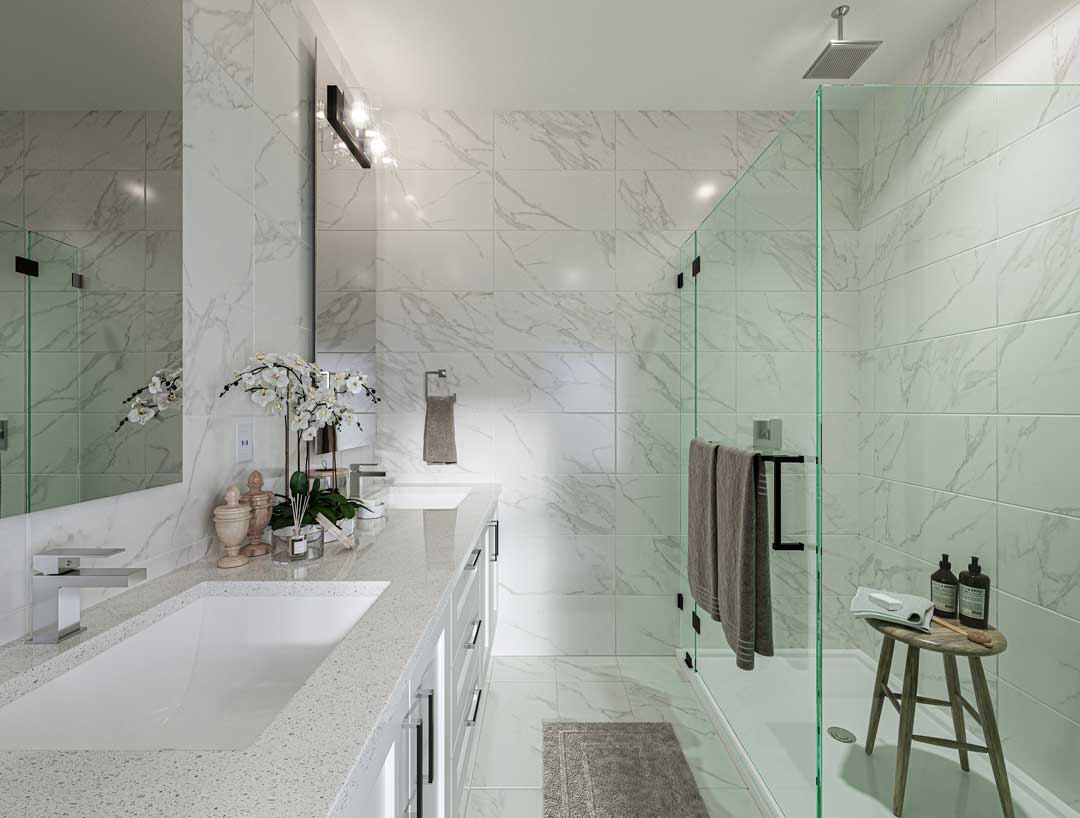 Inspire – Marble-tiled bathroom with a double-sink vanity, large mirror, and a glass-enclosed walk-in shower with a rain showerhead and wooden stool.