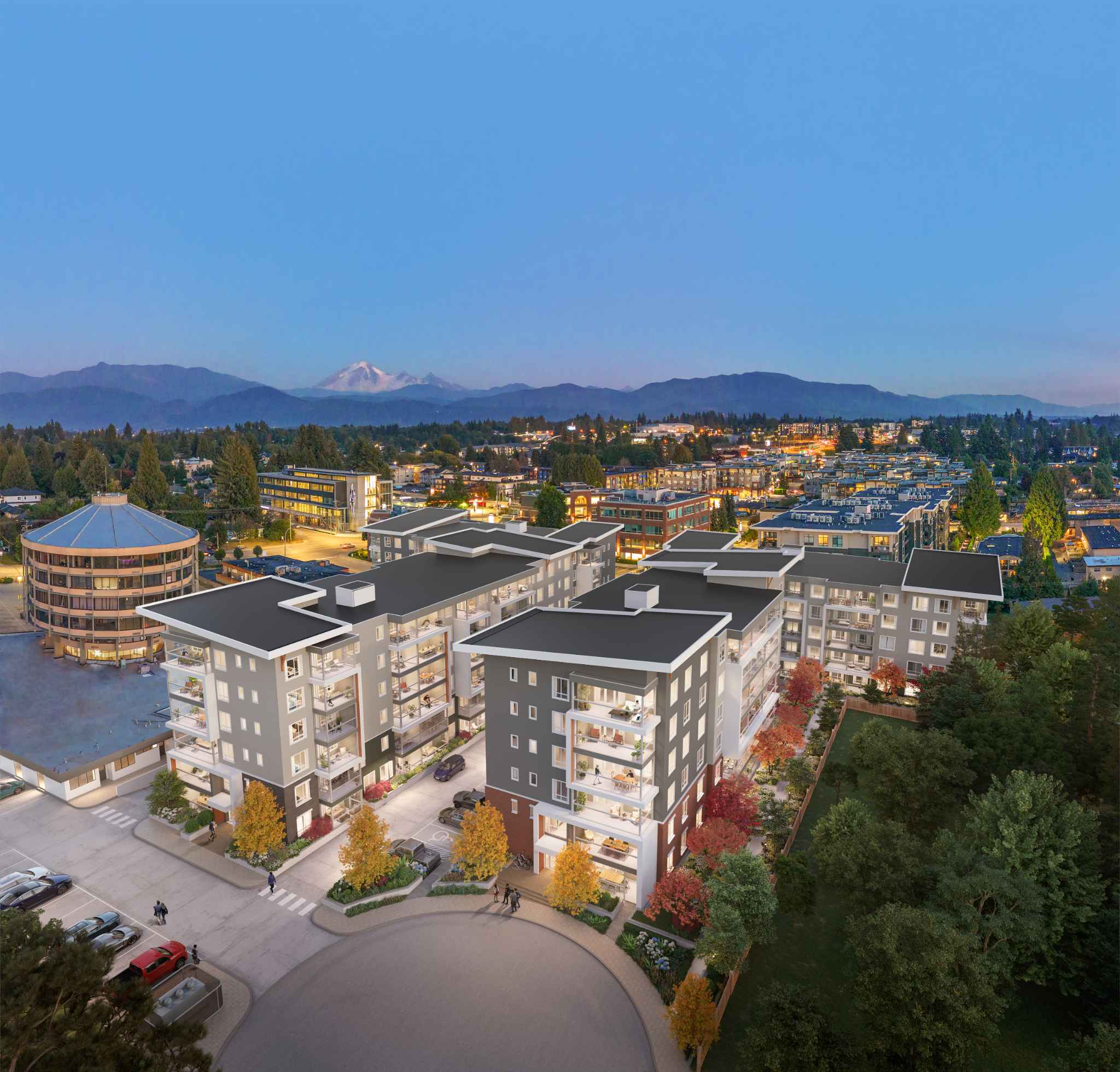 Aria 2 – Aerial rendering at dusk of the residential complex's multiple buildings with a mountain backdrop and surrounding neighborhood.