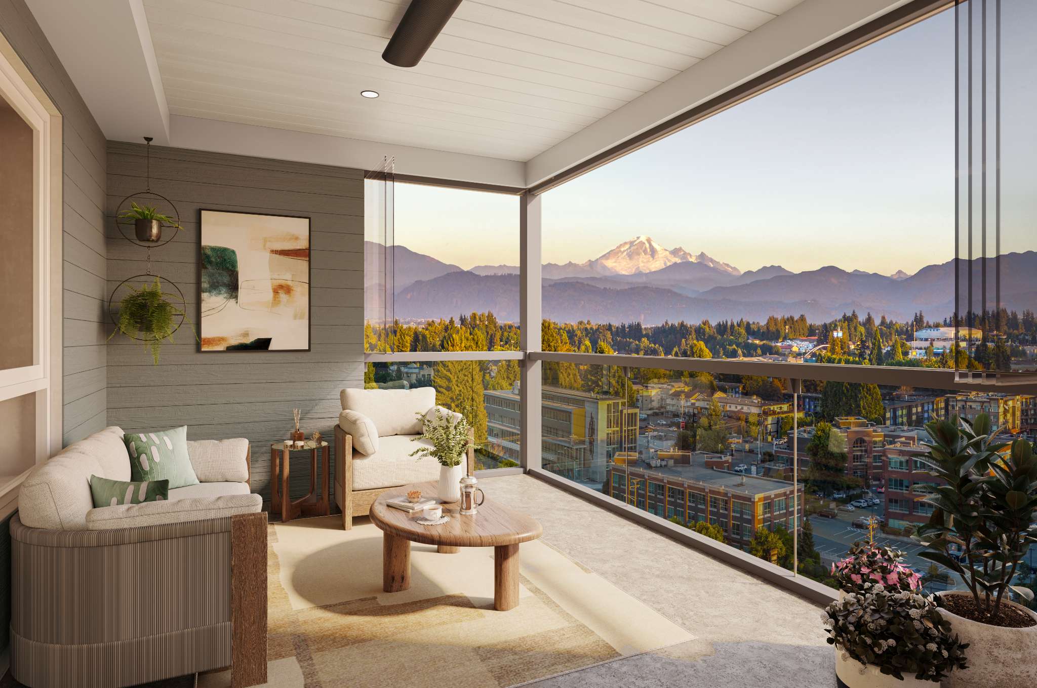 Aria 2 – Covered balcony with outdoor furniture and artwork, overlooking a wide mountain range and city rooftops at sunset.