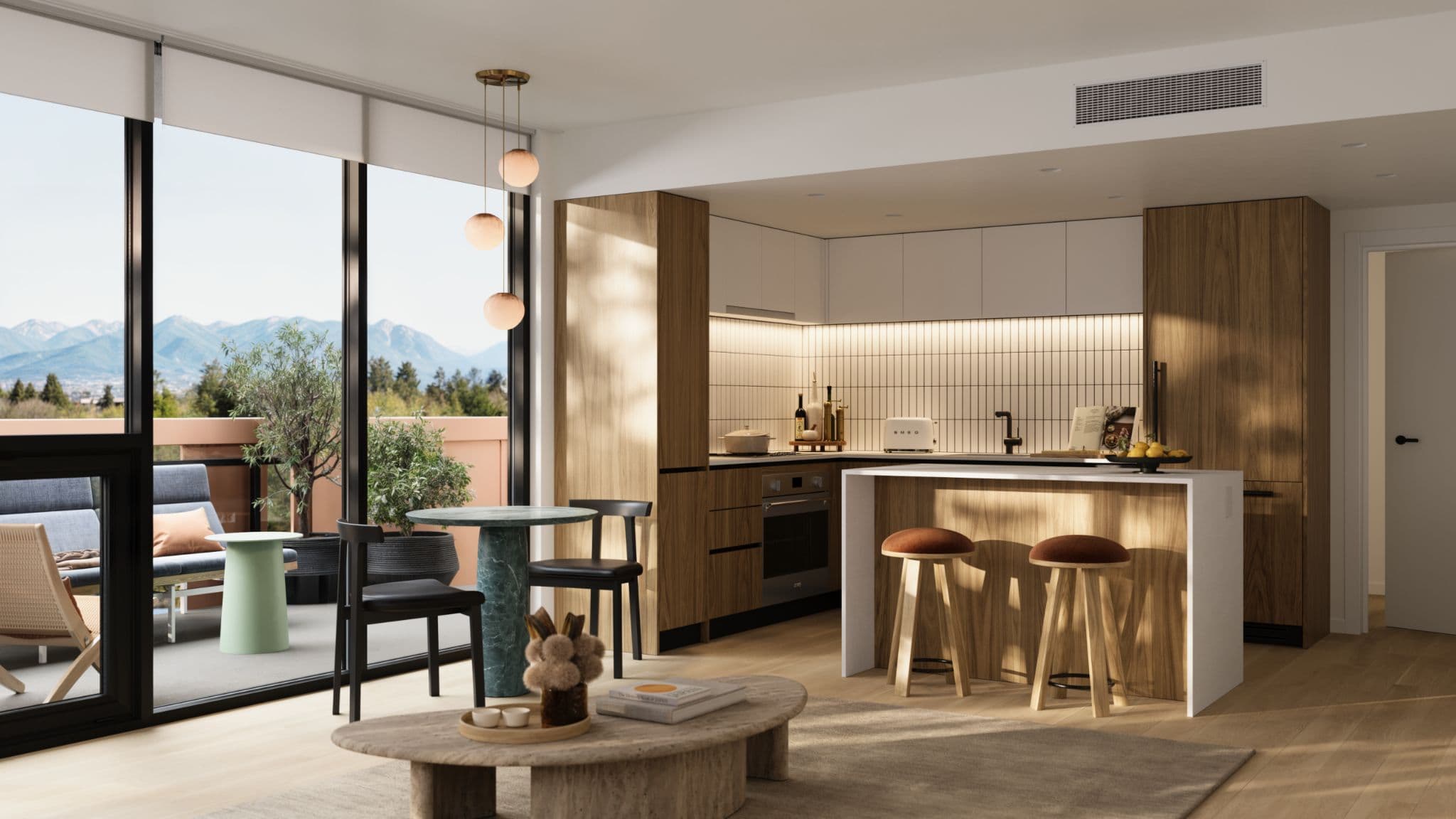 Little Mountain – Open kitchen and living area with wood cabinetry, a green marble dining table, black bar stools, and floor-to-ceiling windows showing a mountain view from a balcony.