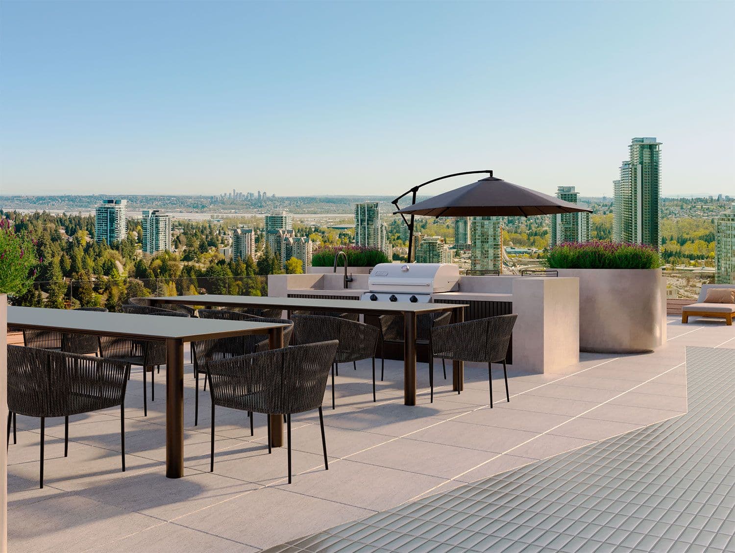 Elements – Rooftop dining terrace with an outdoor BBQ kitchen, umbrella-shaded table seating, and a panoramic view of the city skyline.