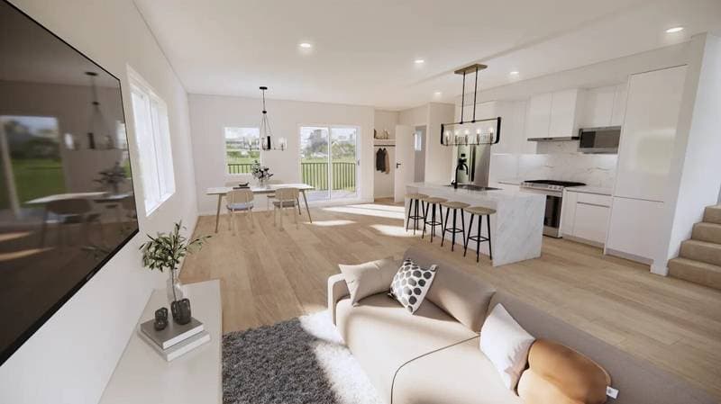 The Signature – A bright, open-concept living area features light wood flooring, a modern kitchen with a waterfall marble island and white cabinetry, and an adjacent dining space. Large sliding glass doors and windows overlook an outdoor balcony, filling the space with natural daylight that illuminates the contemporary sofa and wall-mounted television in the foreground.