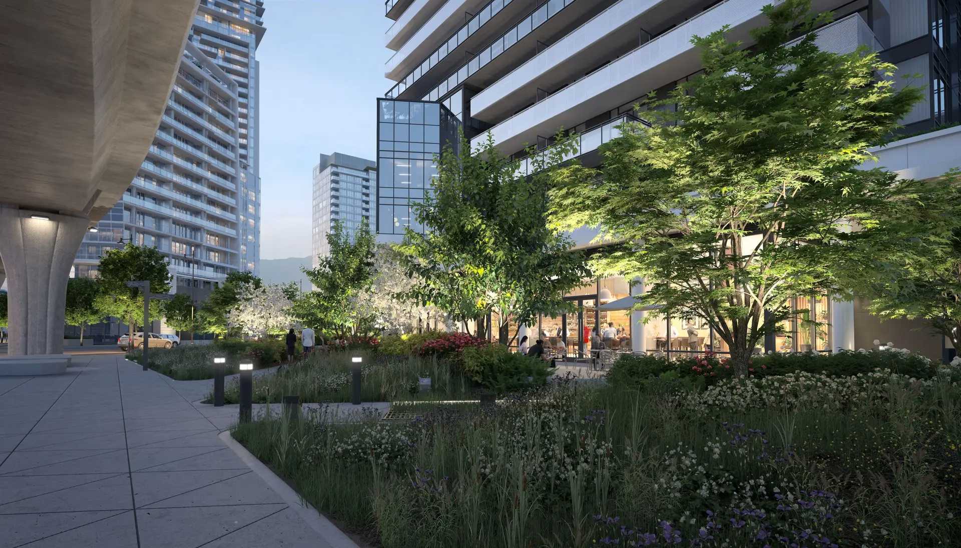 Elmwood – A ground-level view of a contemporary high-rise residential tower featuring lushly landscaped walkways, wildflowers, and trees in the foreground. Ground-floor retail or café spaces glow with warm light as pedestrians stroll nearby, set alongside a concrete elevated roadway structure under a clear twilight sky.