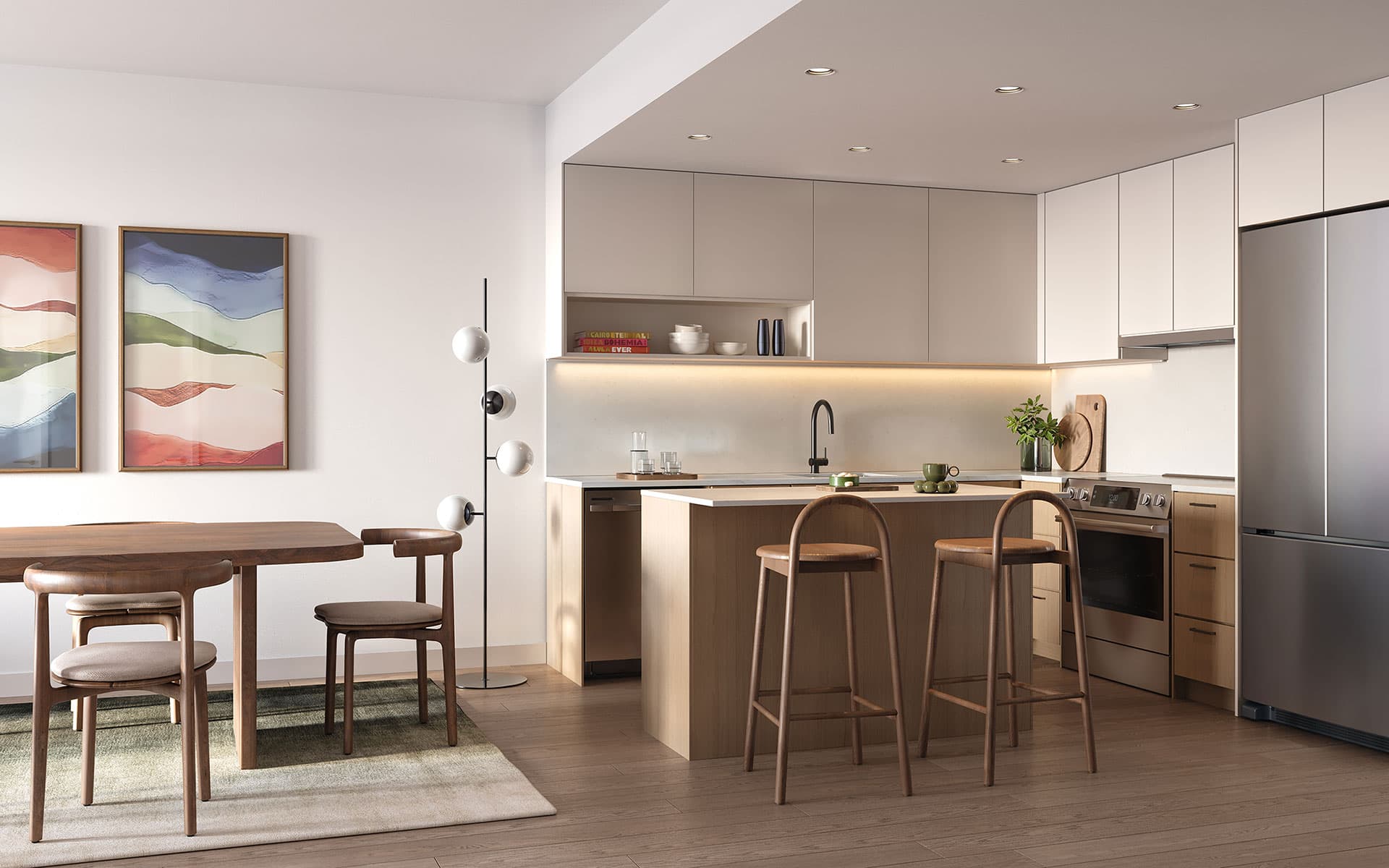 Matteō – Kitchen with light taupe upper cabinets, wood lower cabinets, a wood island with bar stools, and a stainless range and fridge, open to a dining area.