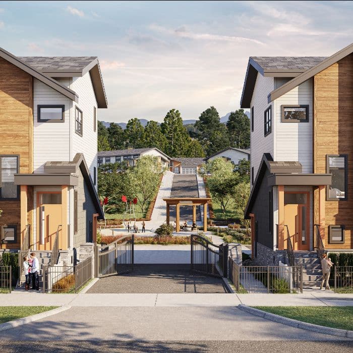 Everwood – Row of two-story duplex homes facing each other across a central gated walkway with landscaping, a pergola, and mountain views in the distance.