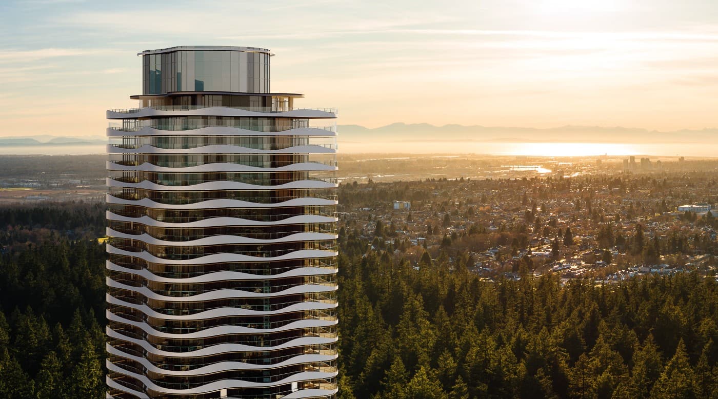 Greenhouse – An aerial rendering of the tower seen from below tree level, with dense forest, a river or bay, and city skyline in the hazy distance at sunrise.