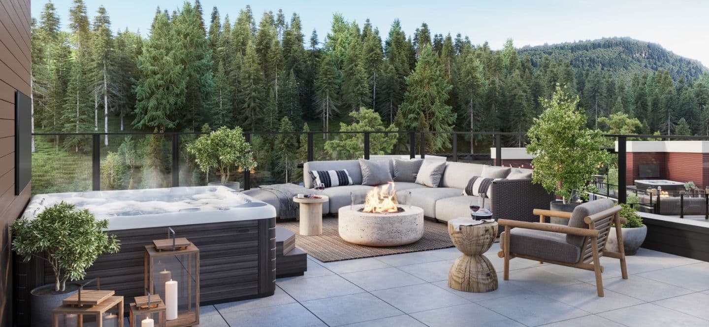 Grovemont – A spacious outdoor rooftop terrace featuring a steaming hot tub, comfortable sectional seating, a wooden armchair, and a glowing round fire pit. The paved patio is enclosed by glass railings, looking out onto a dense evergreen forest under bright daylight.