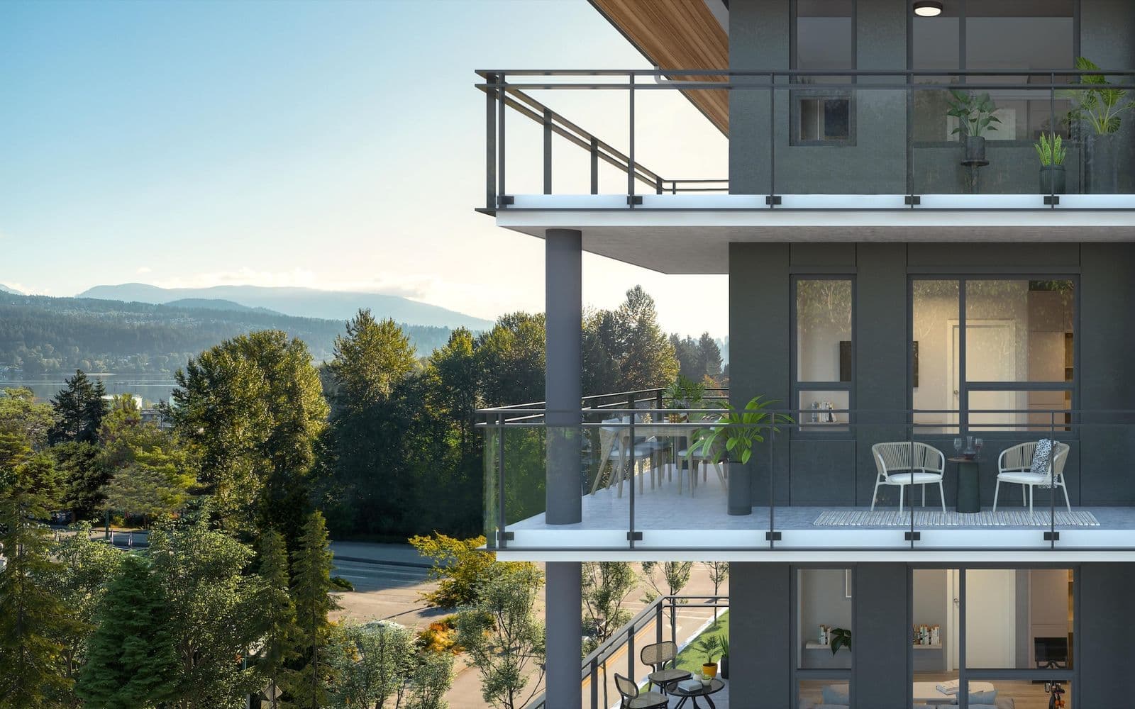 Hue – Close-up rendering of condo balconies with furniture, showing interiors through glass doors and a forested mountain view behind.