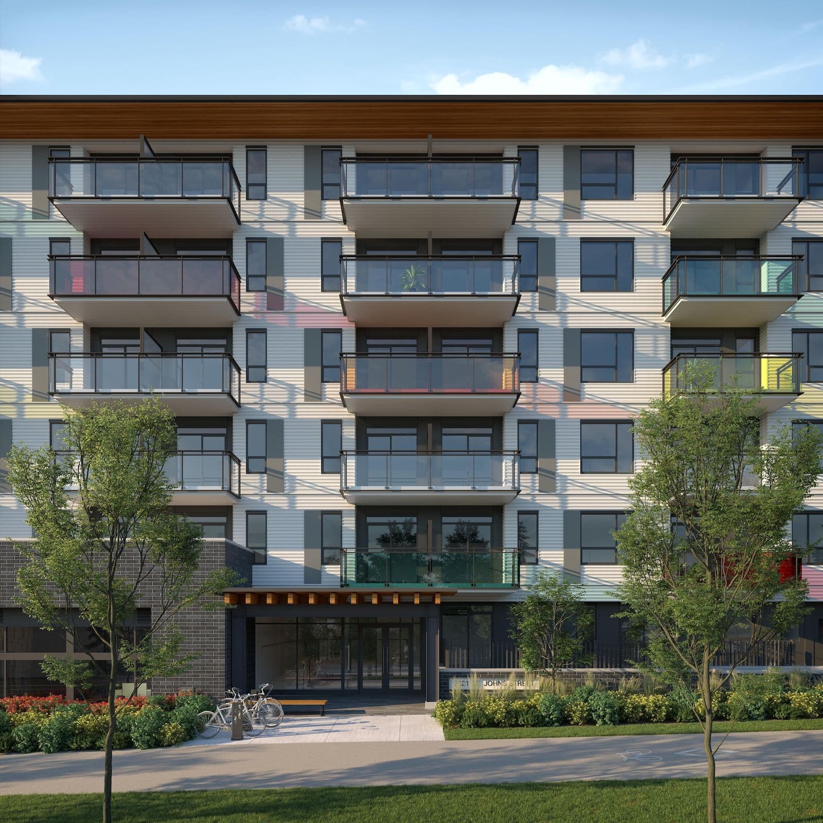 Hue – Rendering of a mid-rise condo building with corrugated white siding and colorful glass balcony accents, labeled 2121 St Johns Street.