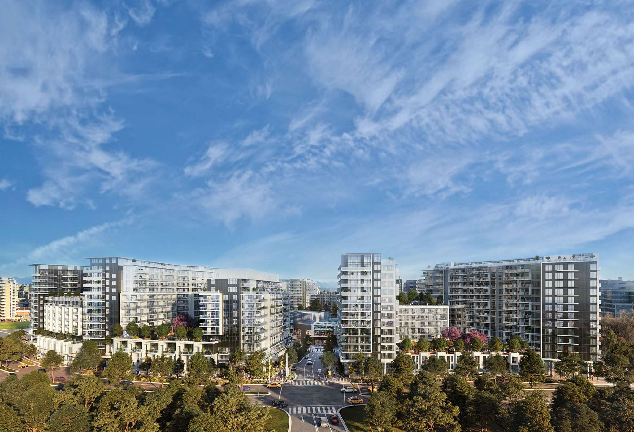 RC at CF Richmond Centre – An elevated view showcases a sprawling modern master-planned residential community featuring glass mid-rise condominium buildings with lush rooftop terraces. Below, tree-lined streets, crosswalks, and surrounding greenery surround the development under a bright blue sky with wispy clouds.