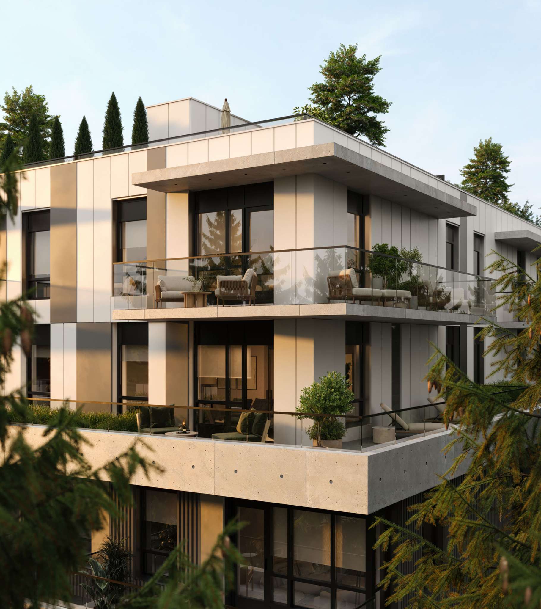Arden – A modern residential building features concrete overhangs, white wall panels, and spacious private balconies fitted with glass railings and comfortable outdoor seating. Warm late-afternoon sunlight illuminates the building corner, which is framed by lush evergreen trees.