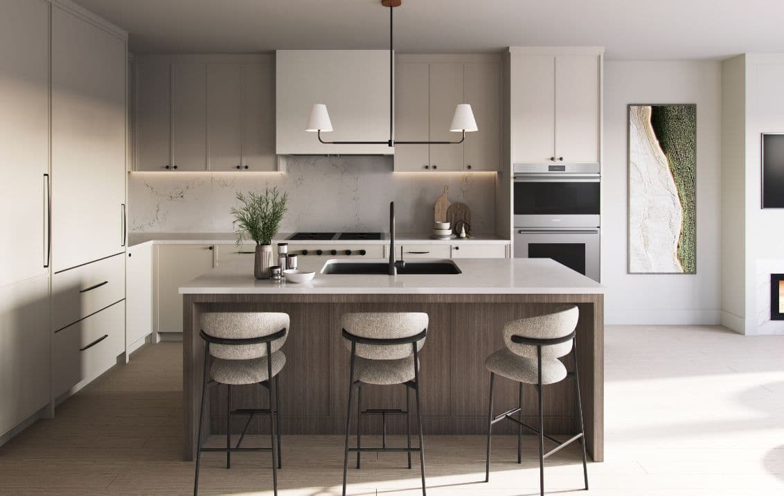Harlowe House – A contemporary kitchen interior centered around a dark wood island with white quartz countertops, an undermount sink, and three minimalist barstools. Light taupe cabinetry, a matching marble backsplash, integrated wall ovens, and under-cabinet lighting complete the modern, neutral aesthetic.
