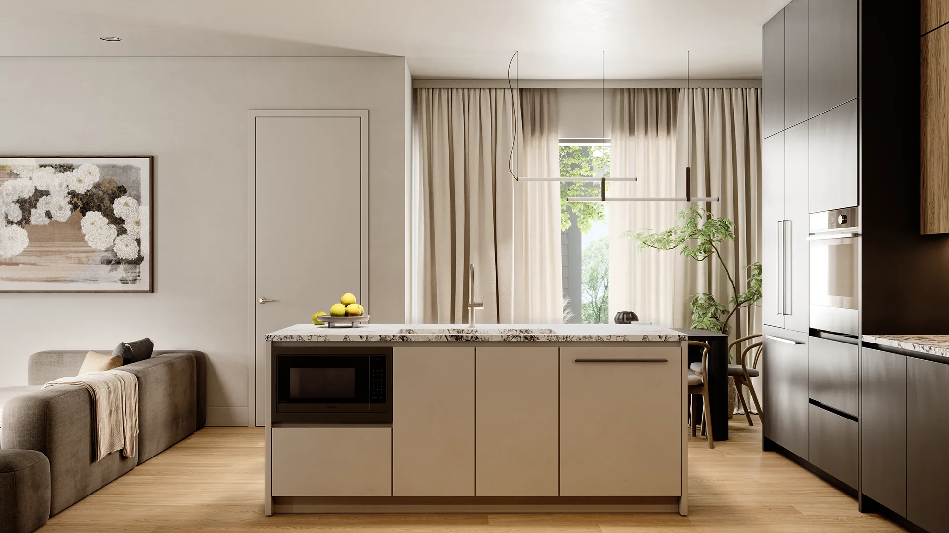 Ansoku – Kitchen island with a marble countertop, built-in microwave, and beige cabinetry, with a living room and dining table visible beyond.