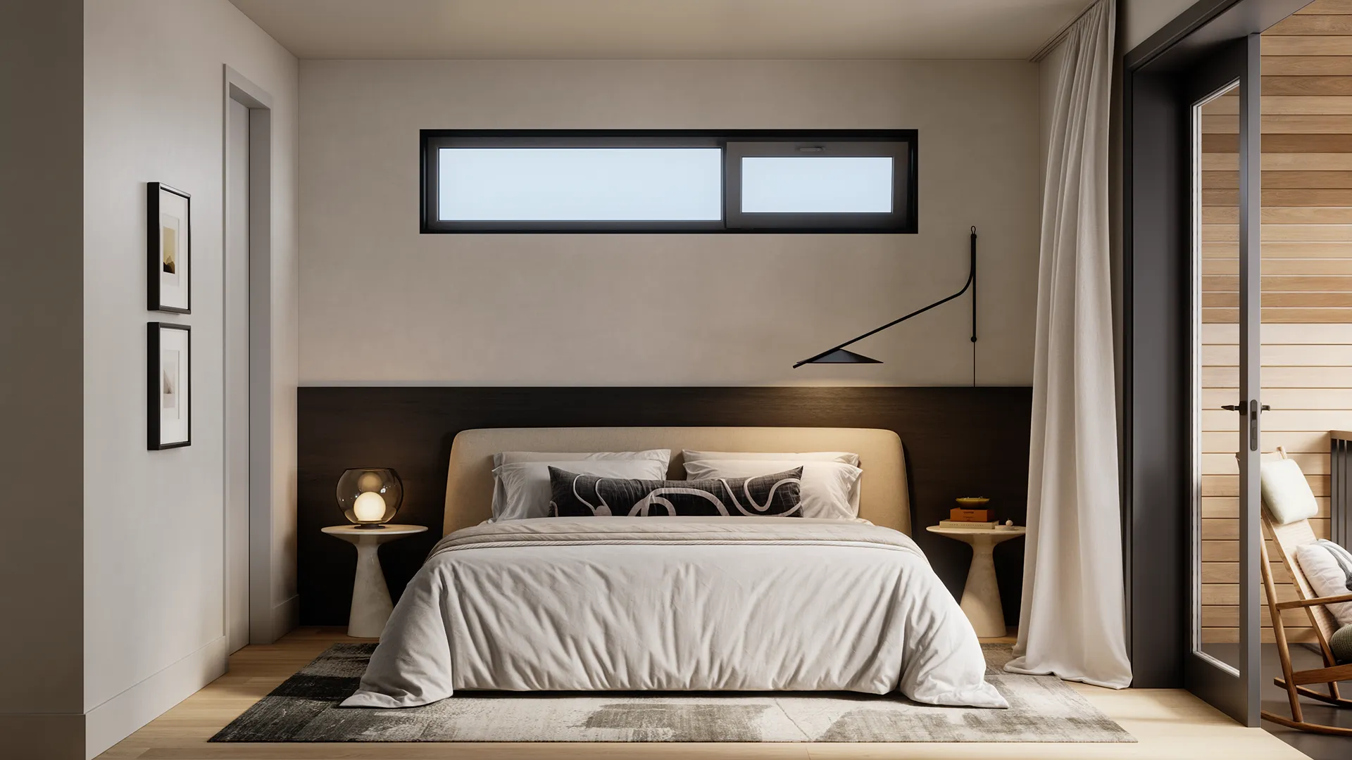 Ansoku – Bedroom with a dark headboard wall, bedside tables with lamps, and glass doors leading to a balcony with a rocking chair.