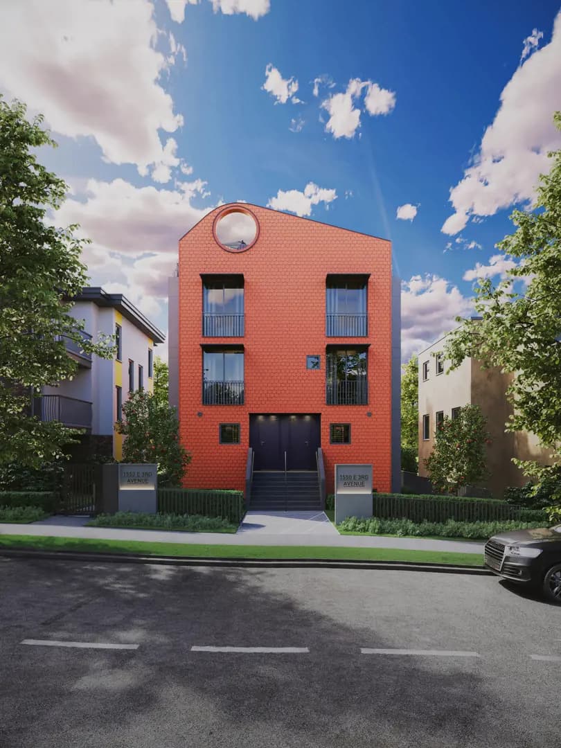 Coral – A straight-on street-level view of a modern multi-story residential building featuring a vibrant orange-red hexagonal textured facade and a distinctive circular roofline opening. The property includes symmetrical black-trimmed windows, a central entryway with steps, manicured landscaping, and neighboring buildings under a bright, partly cloudy blue sky.