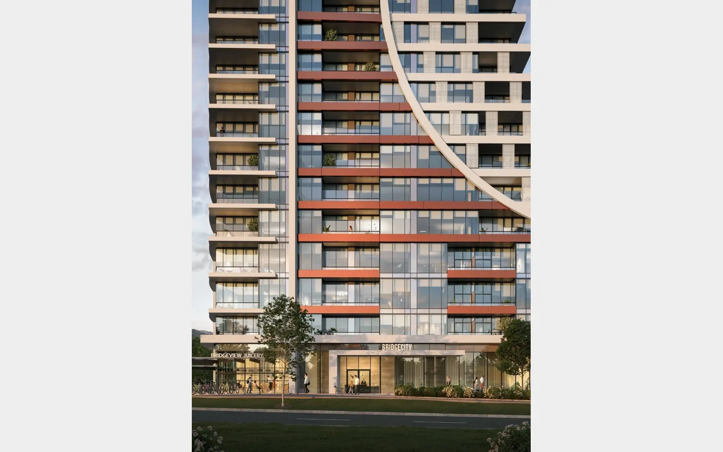 BridgeCity – A ground-level, straight-on view of a modern high-rise tower featuring a distinctive curved facade element and warm copper-toned balcony accents. At street level, pedestrians walk past commercial spaces including a entrance labelled BRIDGE CITY and a juicery.