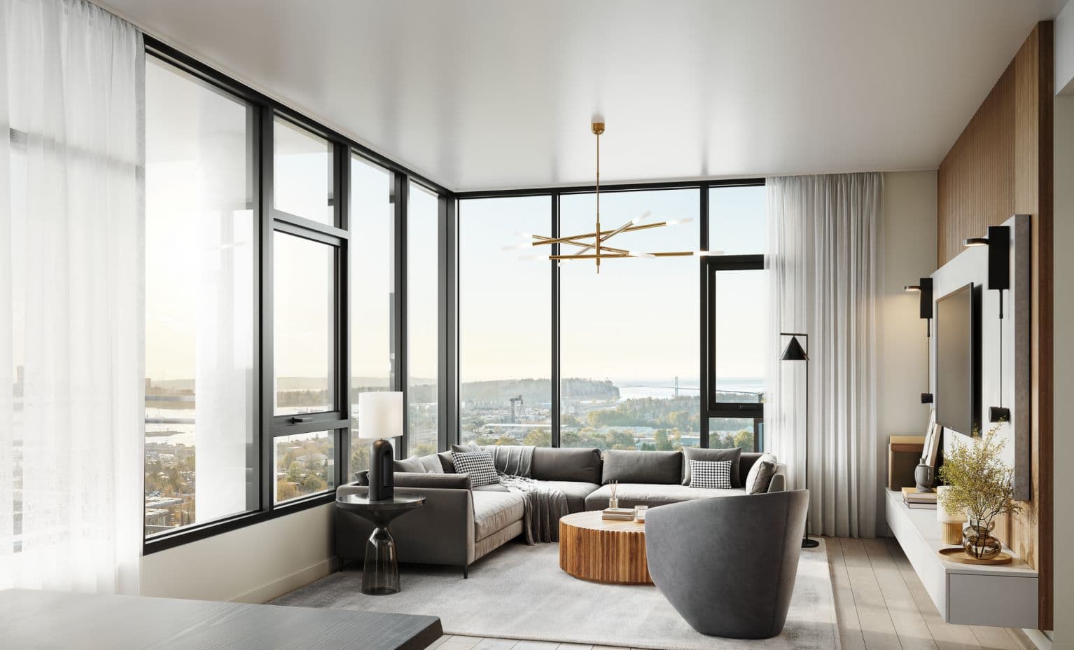 Elle – Rendering of a living room with floor-to-ceiling corner windows overlooking a city and water view, furnished with a gray sectional sofa, round wood coffee table, and a wall-mounted TV.