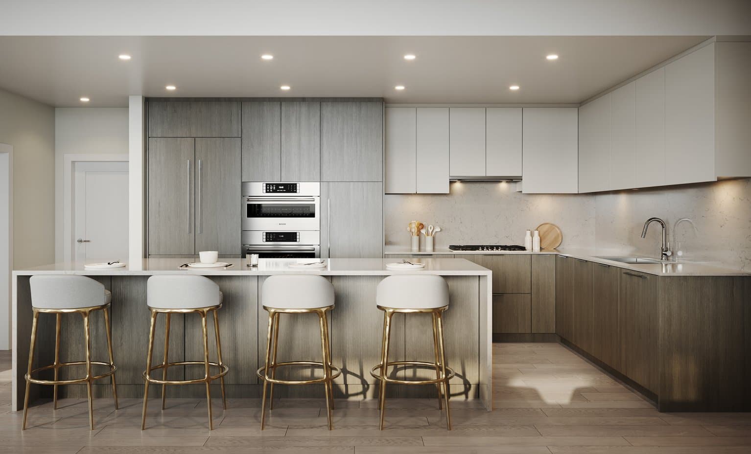 Elle – Rendering of a kitchen with two-tone gray and white cabinetry, a waterfall island with gold-legged stools, and a stainless double wall oven.
