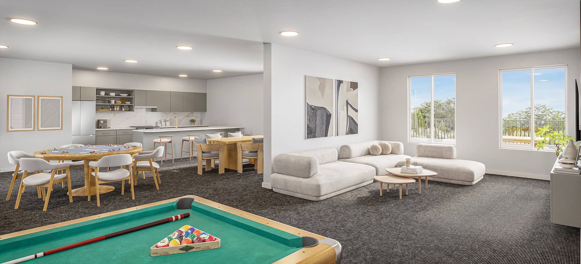 Ravir – Shared lounge and games room with a pool table, sectional sofa, and an adjoining kitchenette with a dining table and card table.