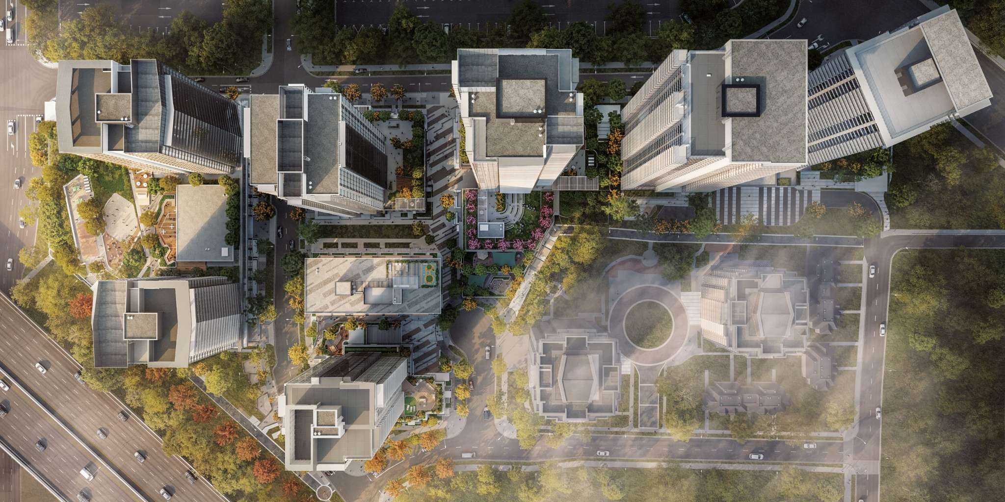 SOCO Two – A top-down aerial masterplan rendering of the development's several towers, courtyards, plaza, and townhomes with a highway alongside.