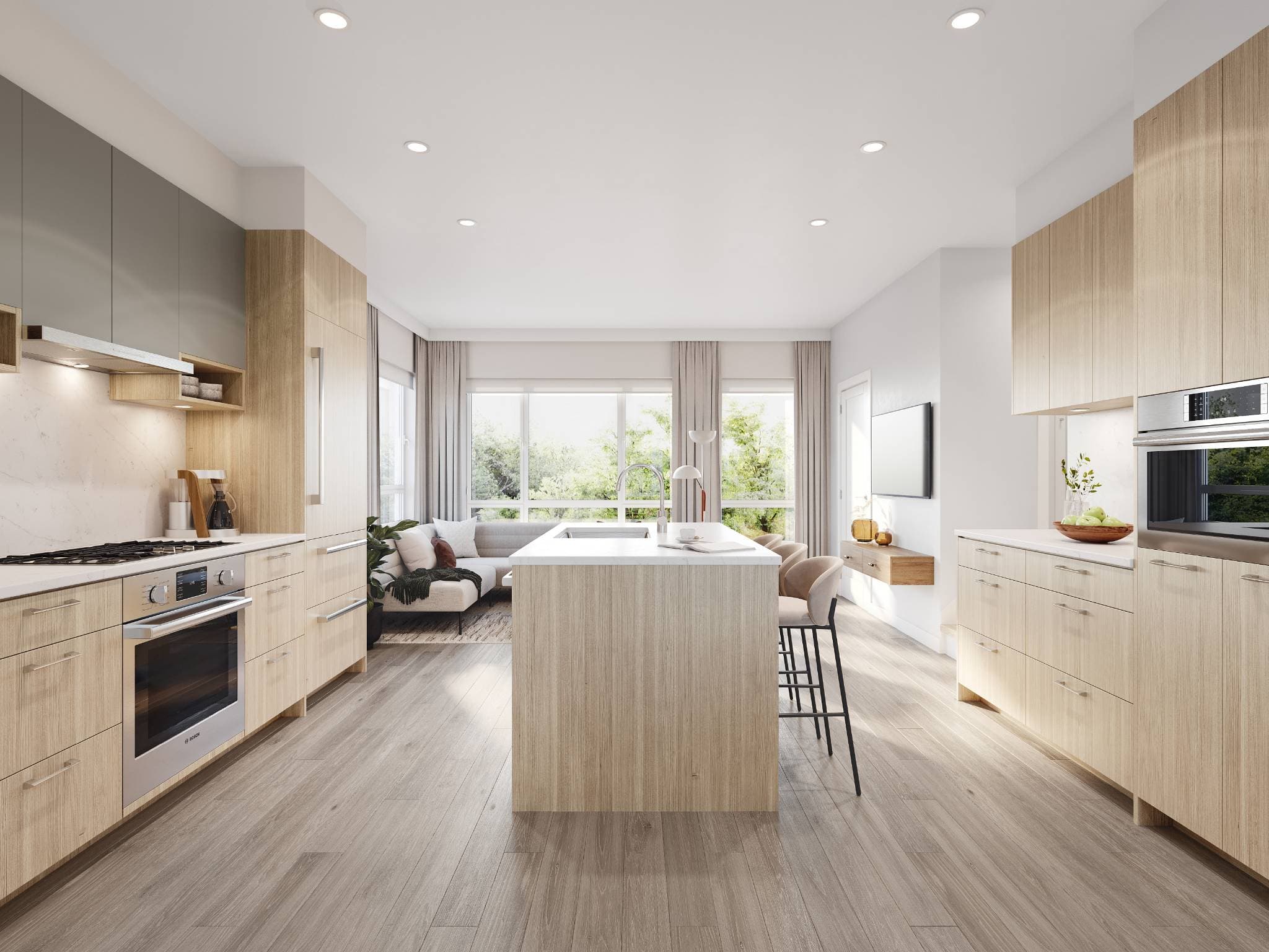 Astrid – A bright, open-concept modern kitchen features light wood grain cabinetry, white quartz countertops, stainless steel appliances, and a central island with bar seating. The space flows seamlessly into a sunlit living area in the background with large windows overlooking lush green trees.