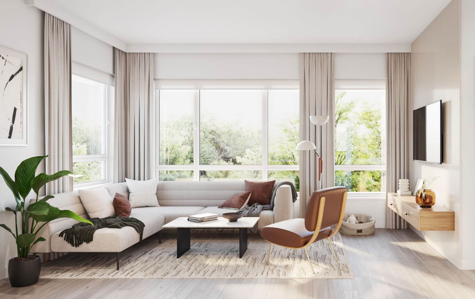Astrid – A bright, modern living room featuring a light beige sectional sofa, a marble coffee table, and a brown leather accent chair positioned around a patterned area rug. Large floor-to-ceiling windows with full-length drapes fill the space with natural light and offer views of lush green trees outside.