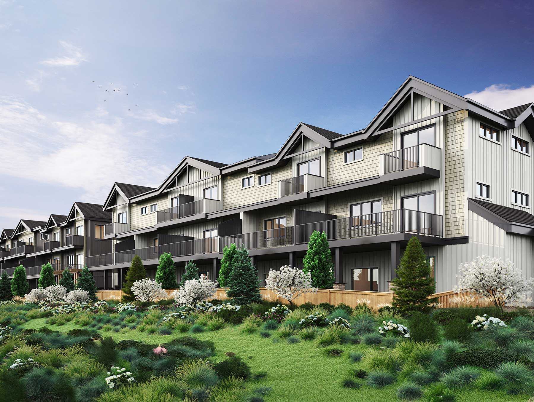 Trailside Milner – Rendering of a row of gabled townhomes with light shingle and board-and-batten siding, multiple balconies, set behind a wood fence with flowering trees and landscaped hillside in front.