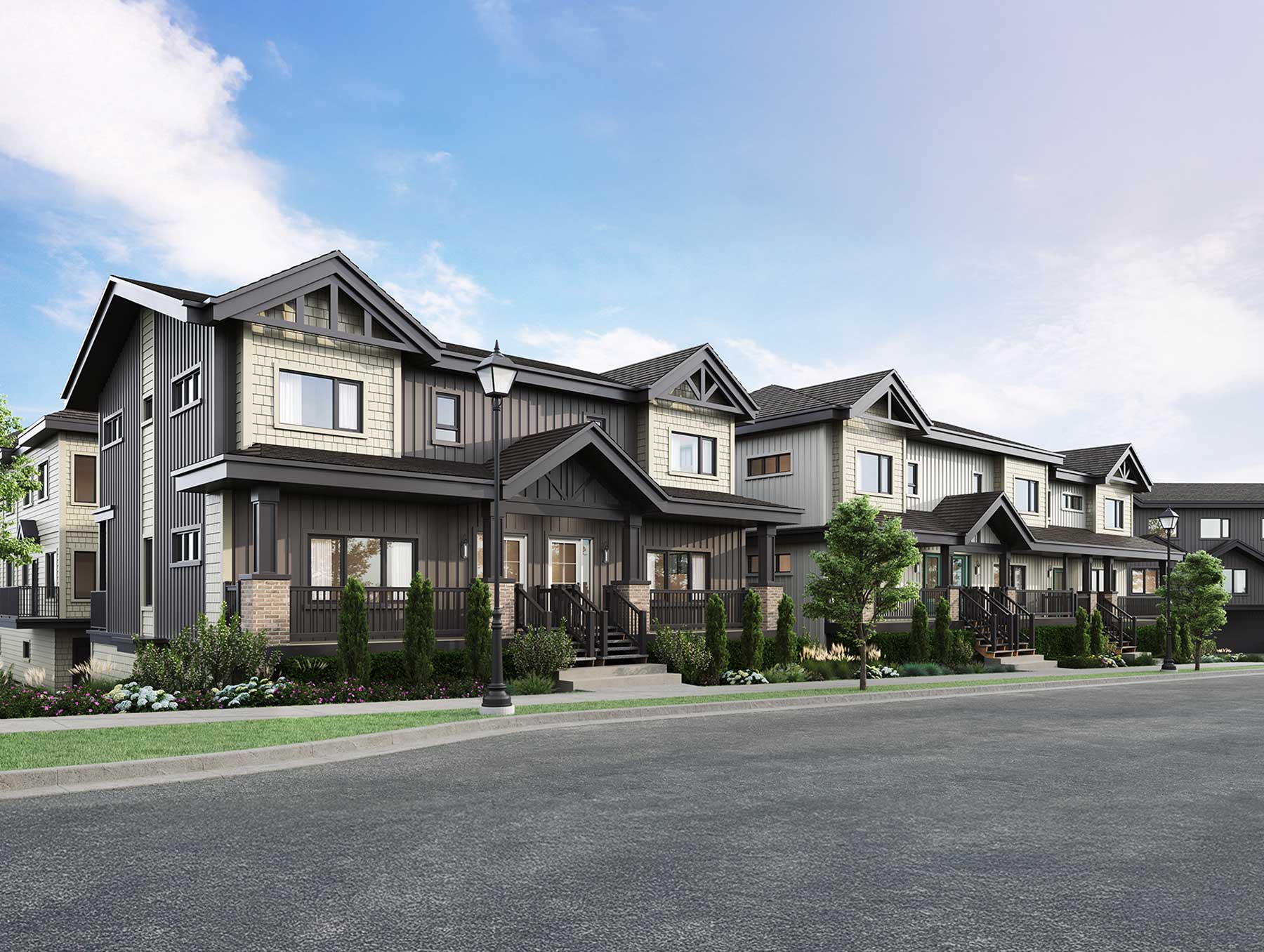 Trailside Milner – Street-level rendering of a row of townhomes with dark gray and cream siding, covered front porches, a street lamp and flowering trees along the road.