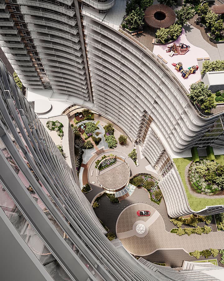 Piano – A high-angle bird's-eye view looks down onto modern curved high-rise towers encircling a central courtyard and roundabout with a red car. The development features multi-level landscaped terraces, garden pathways, and a colorful children's playground bathed in bright daylight.