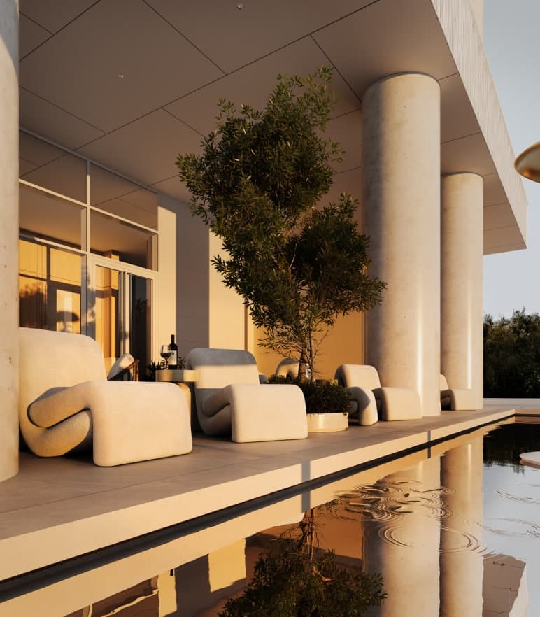 Ethos – A luxurious covered poolside lounge terrace features sculpted, off-white upholstered loungers arranged beneath massive concrete columns and an overhang. Warm golden hour sunlight illuminates the modern architecture and reflects off the calm water of the pool in the foreground.