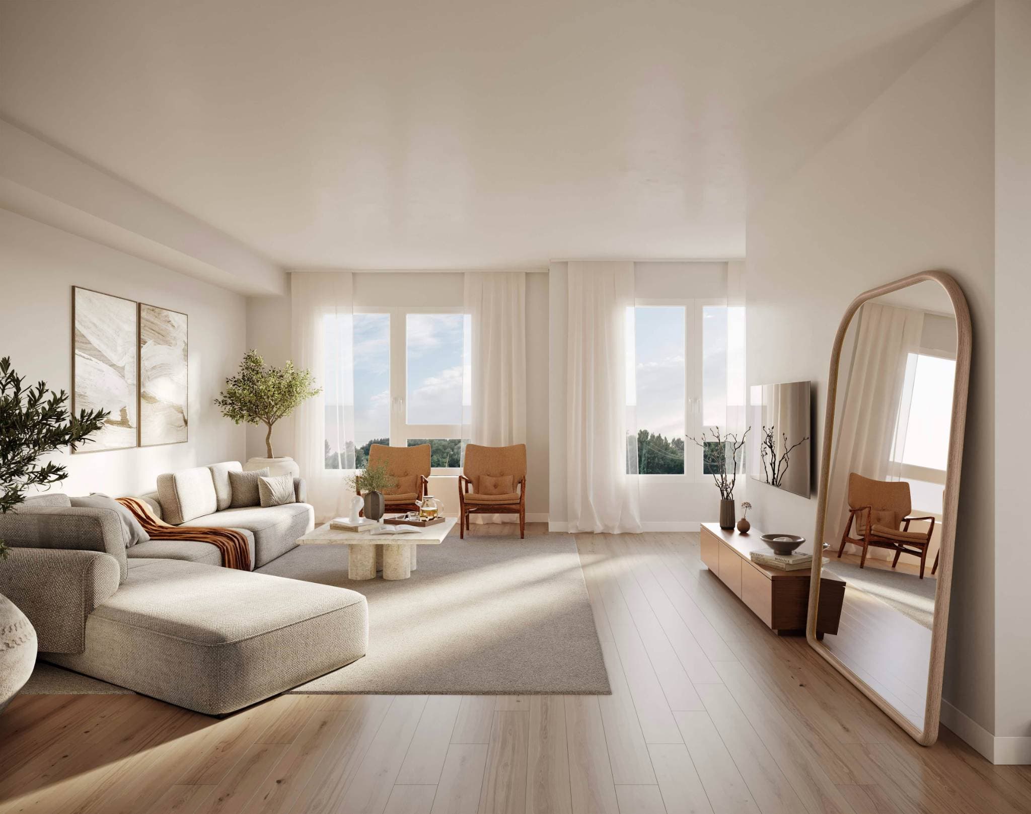 Eden Townhomes – An open-concept living room with a large grey sectional sofa, a stone coffee table, two orange accent chairs, and a wood media console with a tall arched mirror.